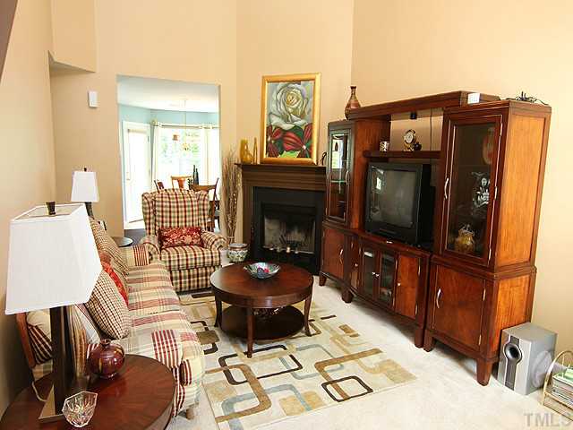 1621 Cricket Ridge Drive Raleigh, NC 27610 - Photo 4 of 25 Beautiful Living room with corner fireplace, neutral colors, and ready for your personal touches.