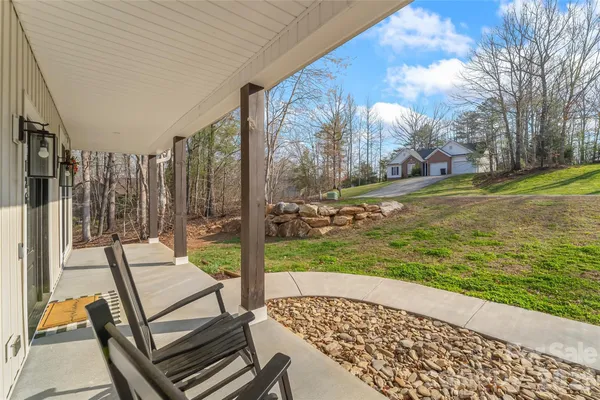 a view of a patio with a yard