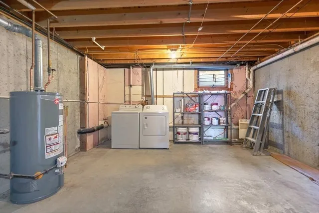 a front view of a house with a garden and parking space