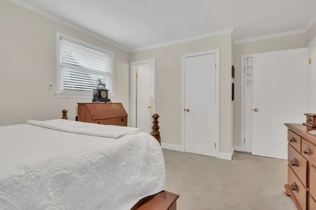 a bed room with a bed and a window