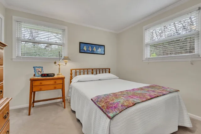 a bedroom with a bed and a table