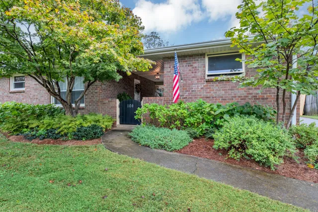 a front view of a house with yard