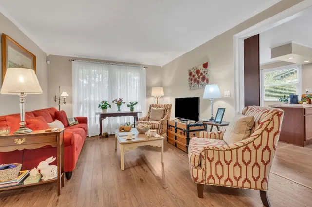 a living room with furniture flat screen tv and a fireplace