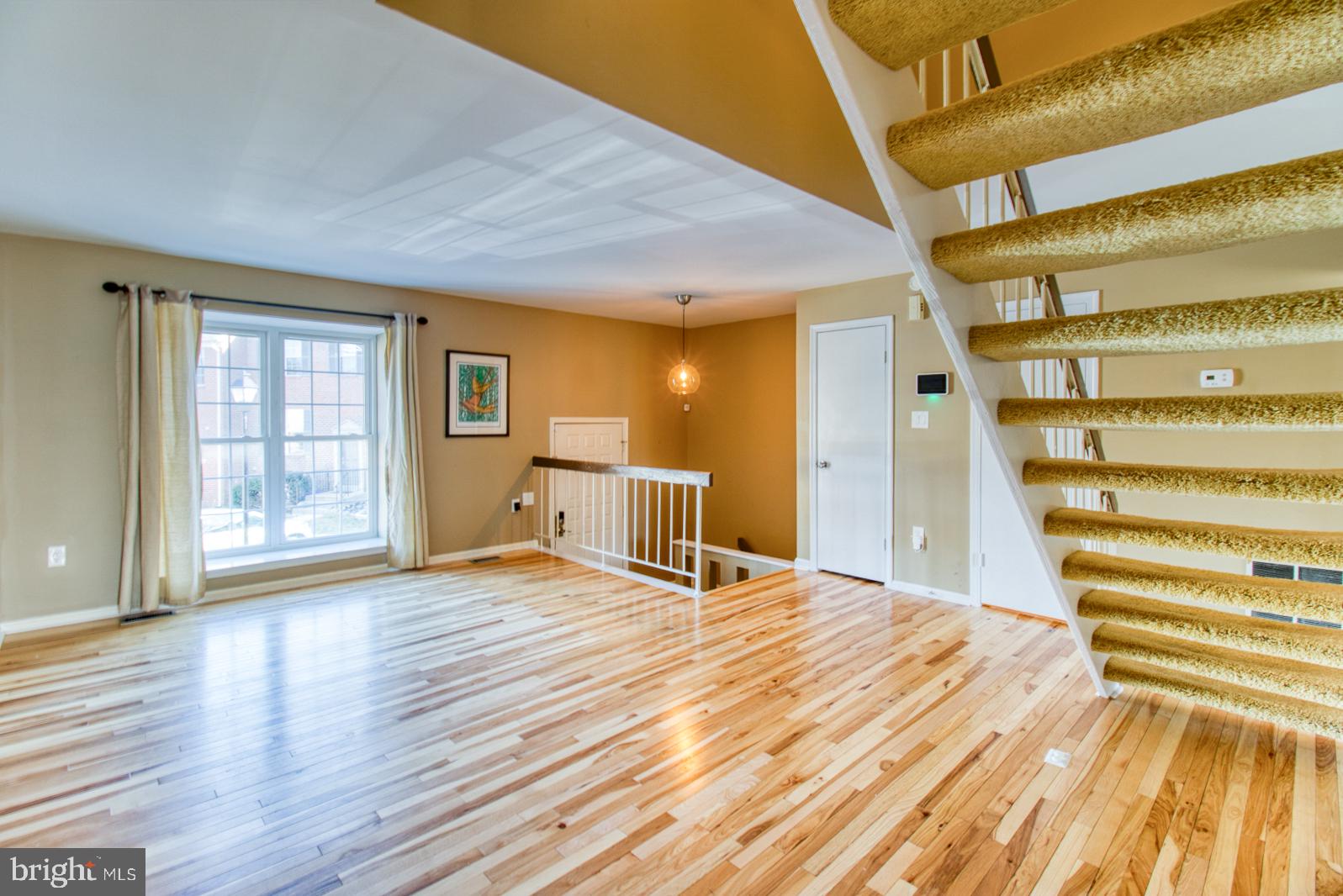 10340 Castlehedge Terrace Silver Spring, MD 20902 - Photo 4 of 62 Sunfilled living room with solid hardwood floors