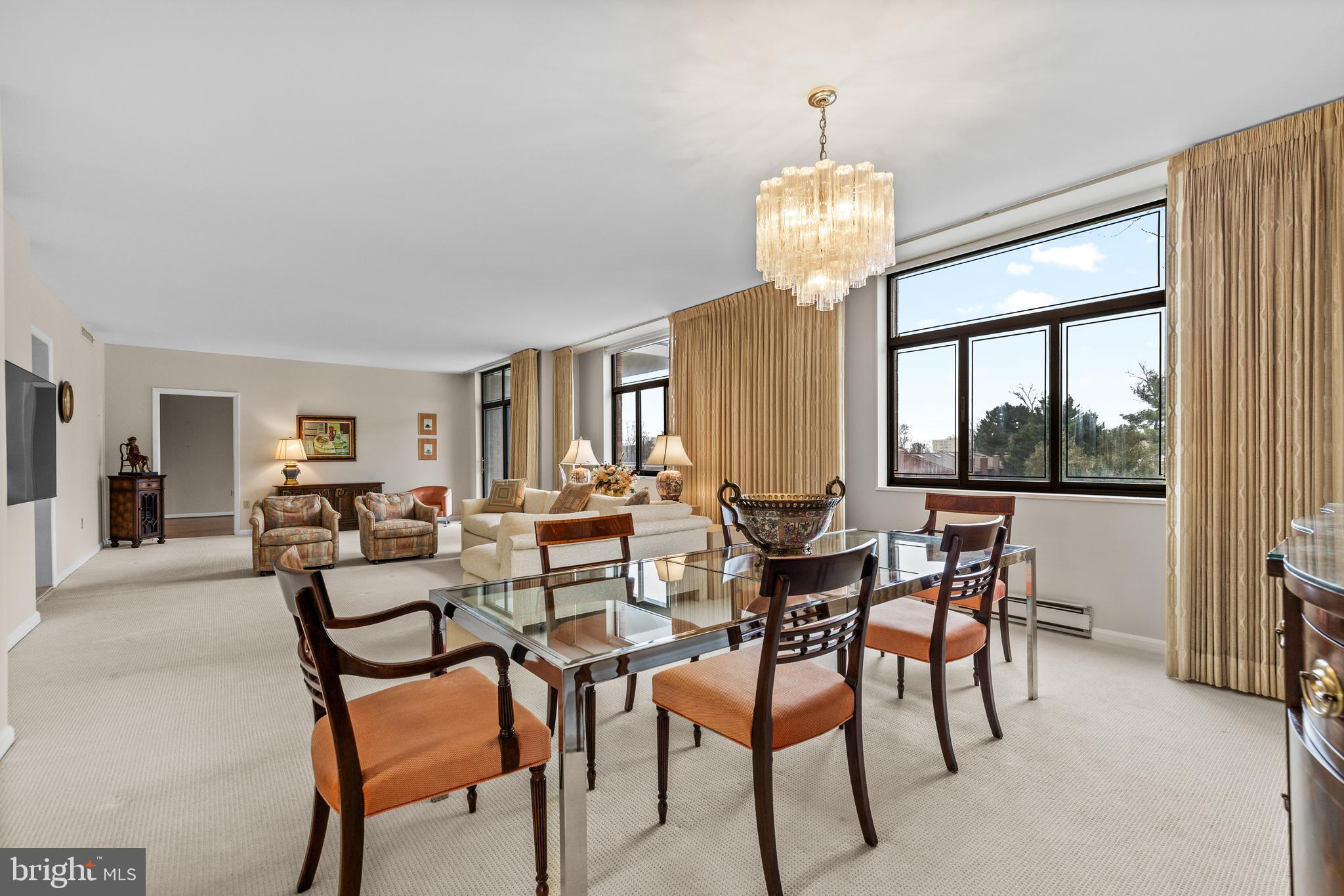 1 Slade Avenue, Unit 304 Baltimore, MD 21208 - Photo 17 of 44 a view of a dining room with furniture window and outside view