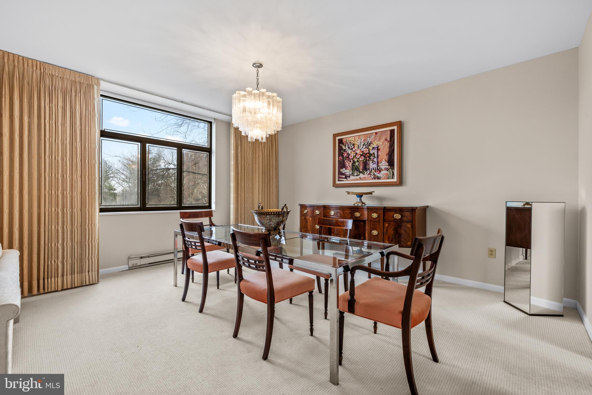 1 Slade Avenue, Unit 304 Baltimore, MD 21208 - Photo 18 of 44 a view of a dining room with furniture window and outside view