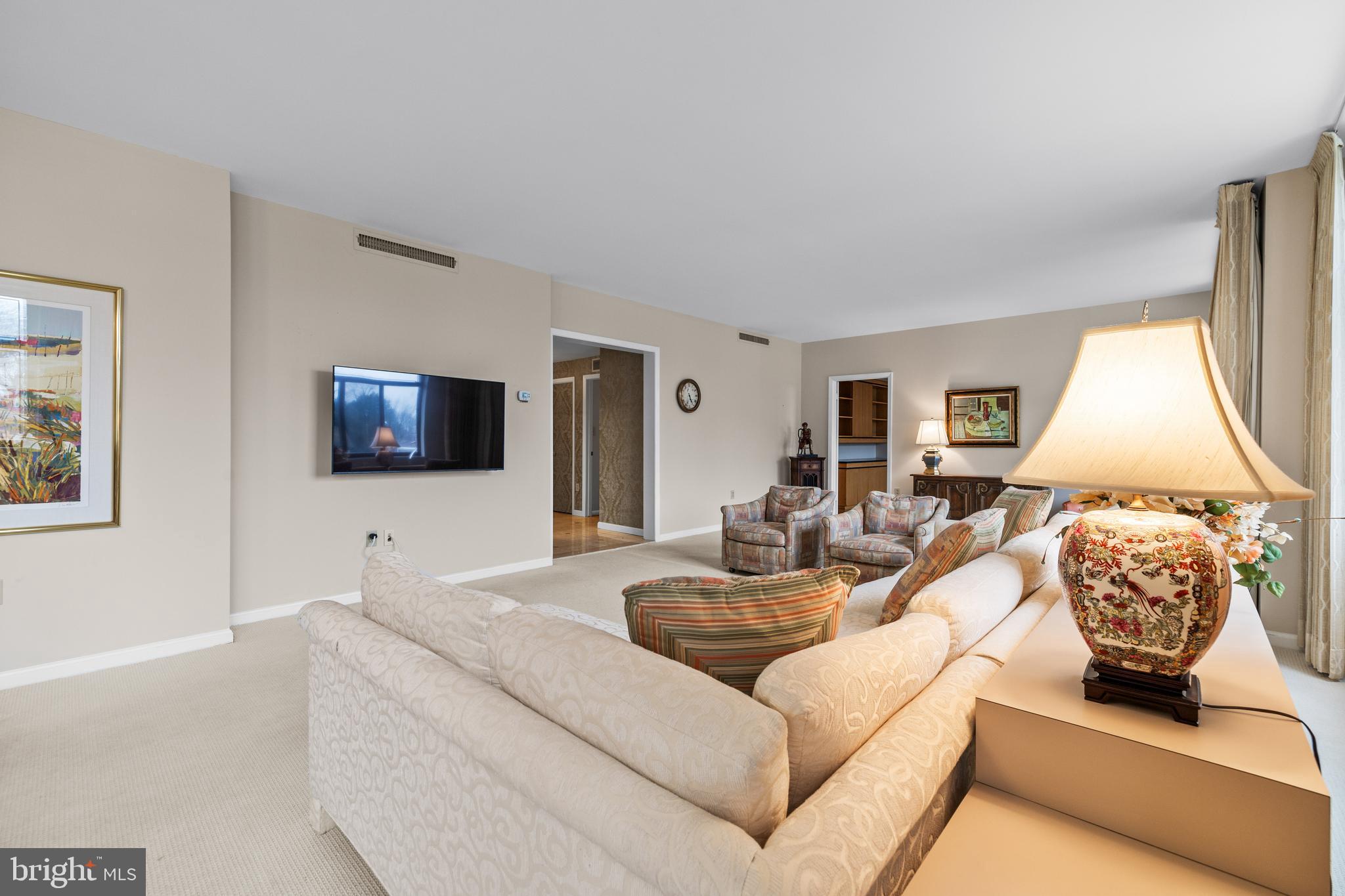 1 Slade Avenue, Unit 304 Baltimore, MD 21208 - Photo 21 of 44 a living room with furniture and a flat screen tv