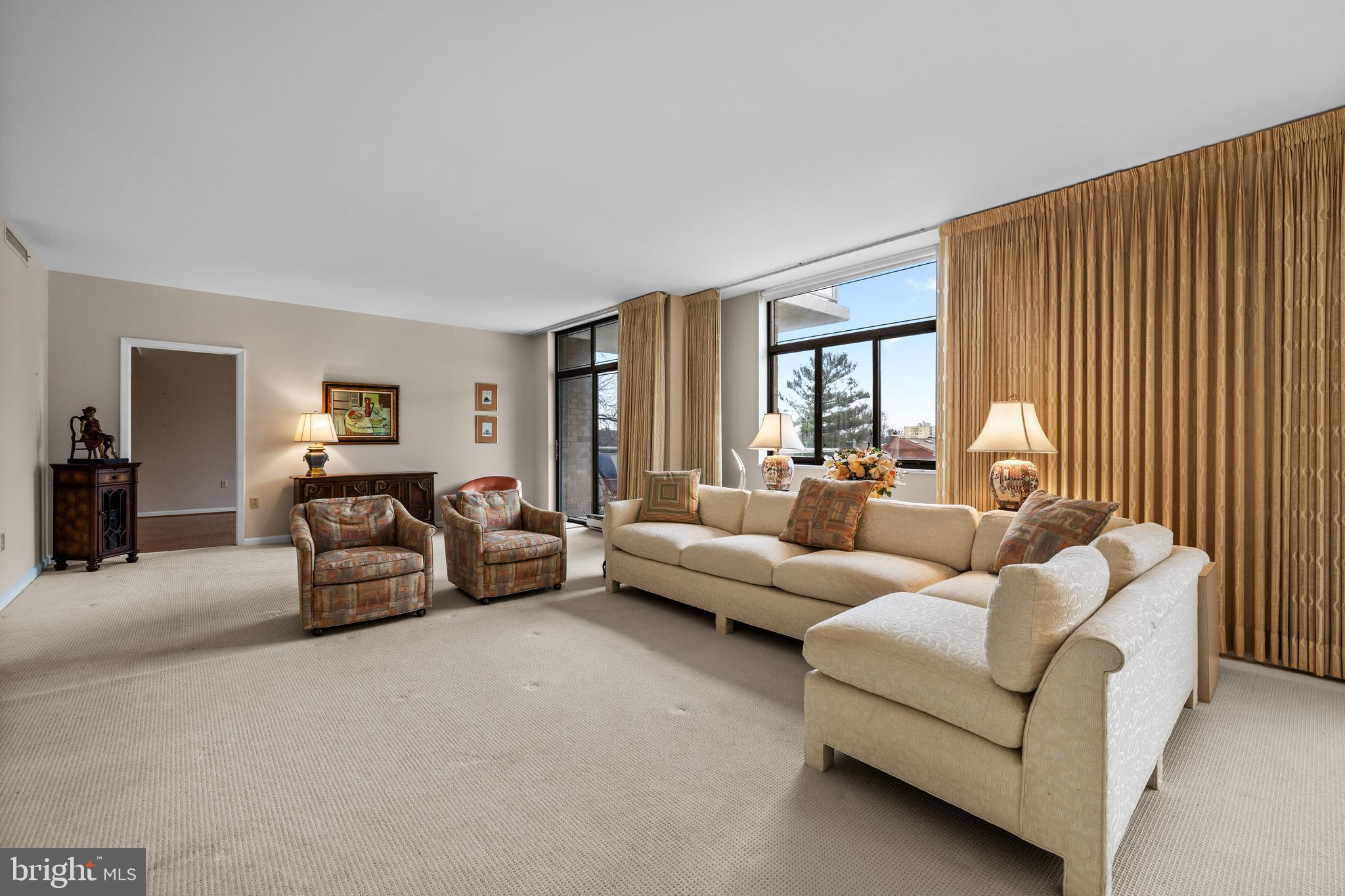 1 Slade Avenue, Unit 304 Baltimore, MD 21208 - Photo 22 of 44 a bedroom with furniture and a couch