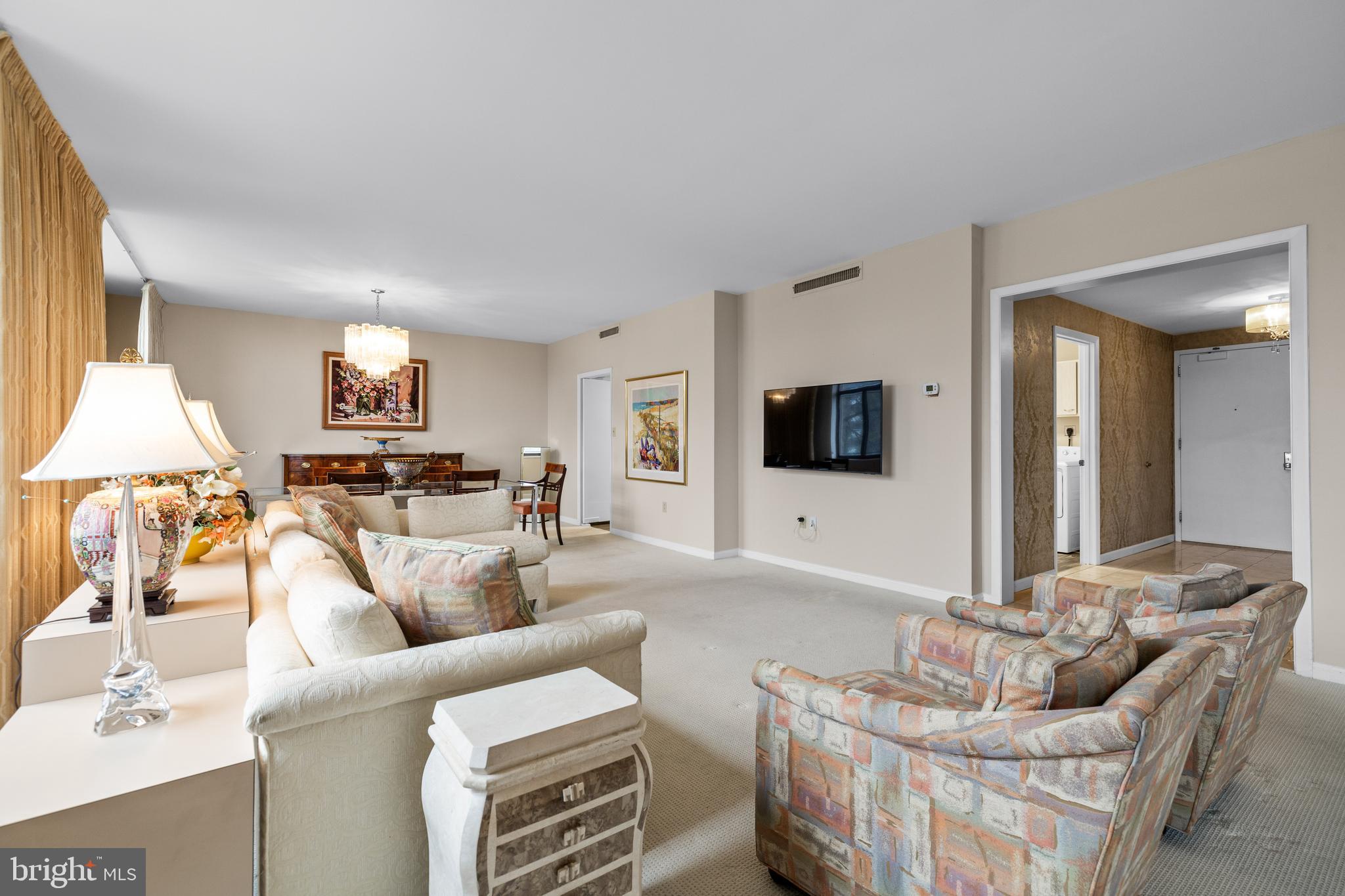 1 Slade Avenue, Unit 304 Baltimore, MD 21208 - Photo 25 of 44 a living room with furniture and a flat screen tv