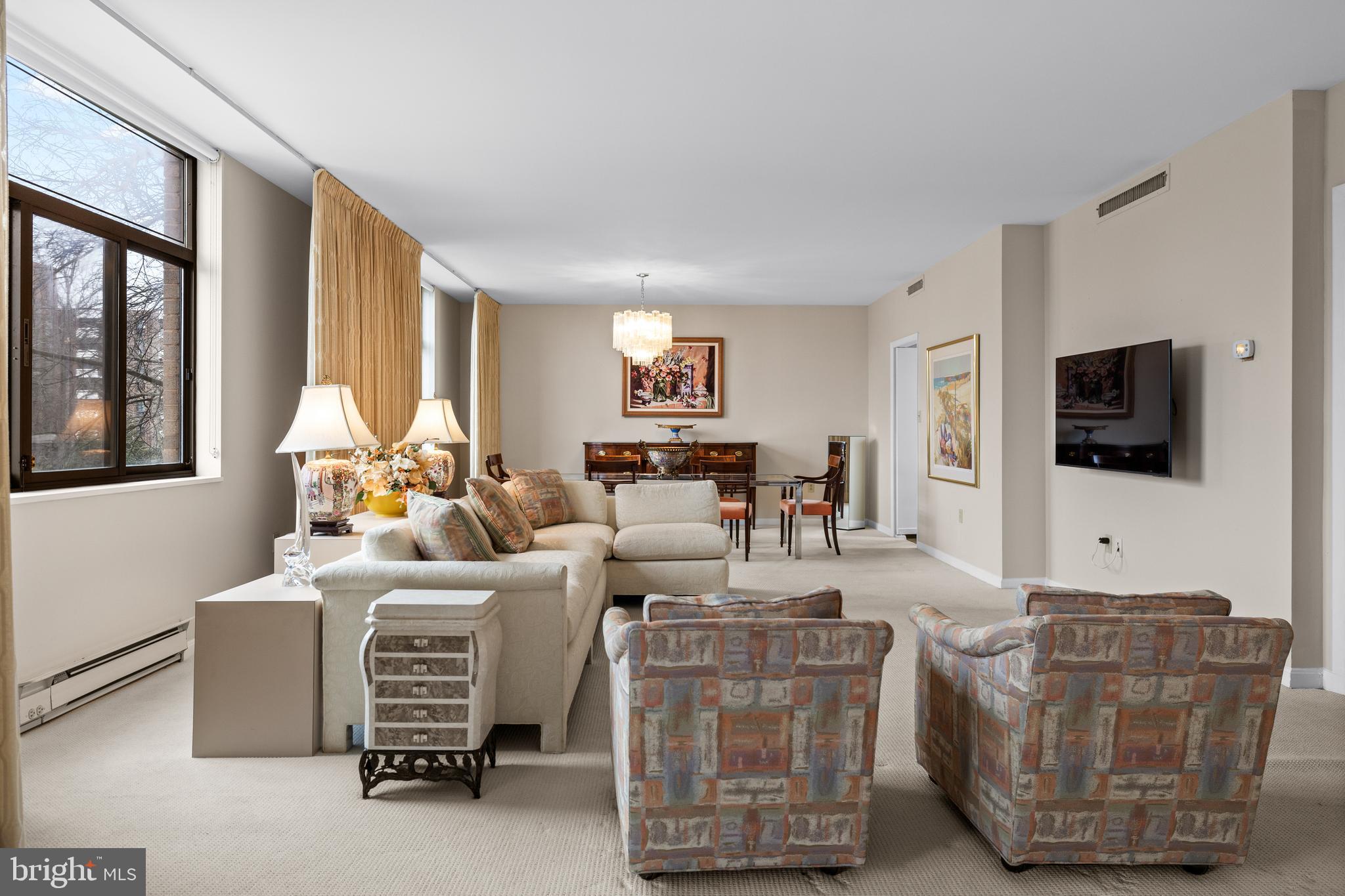 1 Slade Avenue, Unit 304 Baltimore, MD 21208 - Photo 26 of 44 a living room with furniture and a flat screen tv