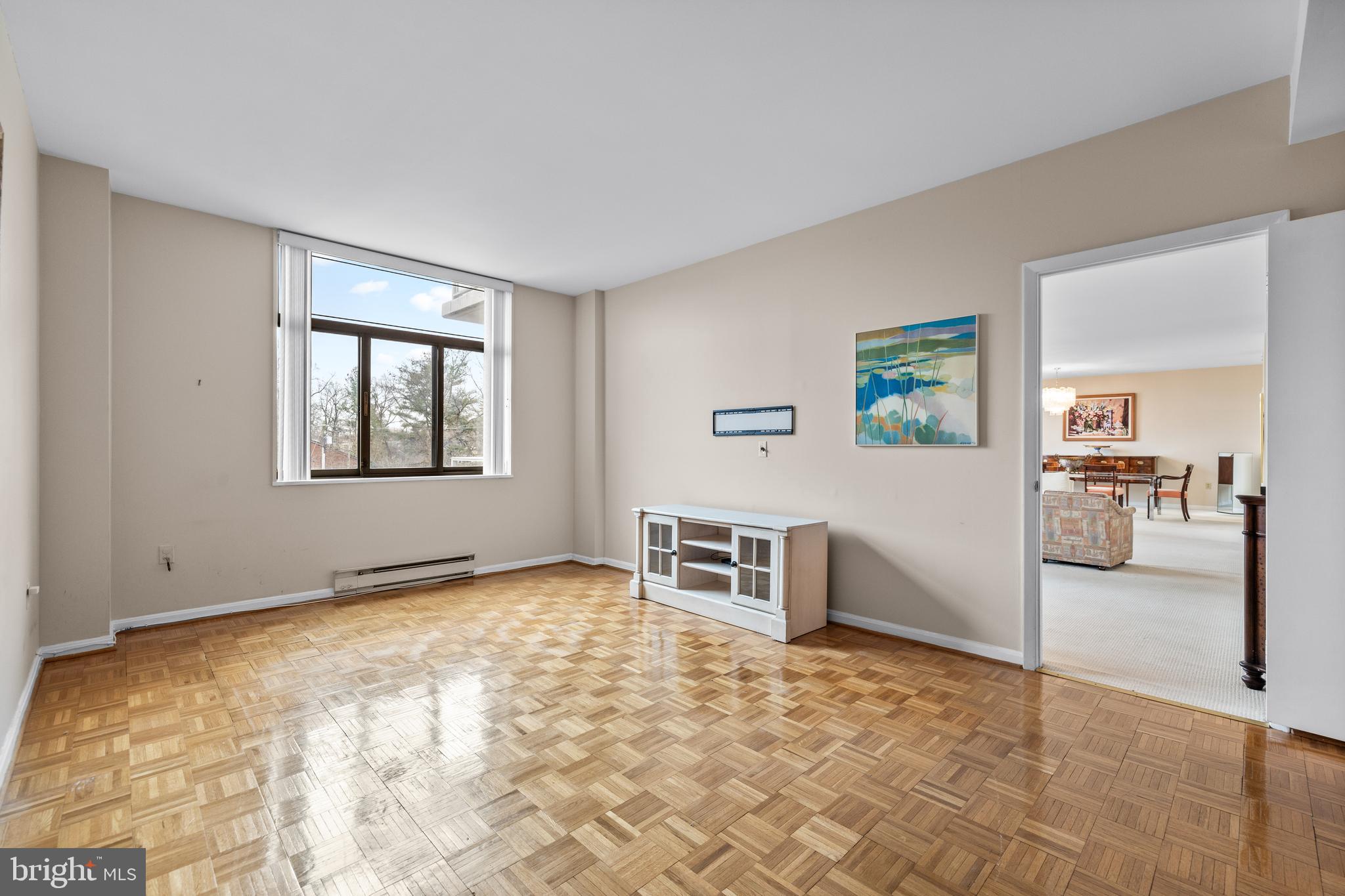 1 Slade Avenue, Unit 304 Baltimore, MD 21208 - Photo 28 of 44 a view of a livingroom with furniture and a window