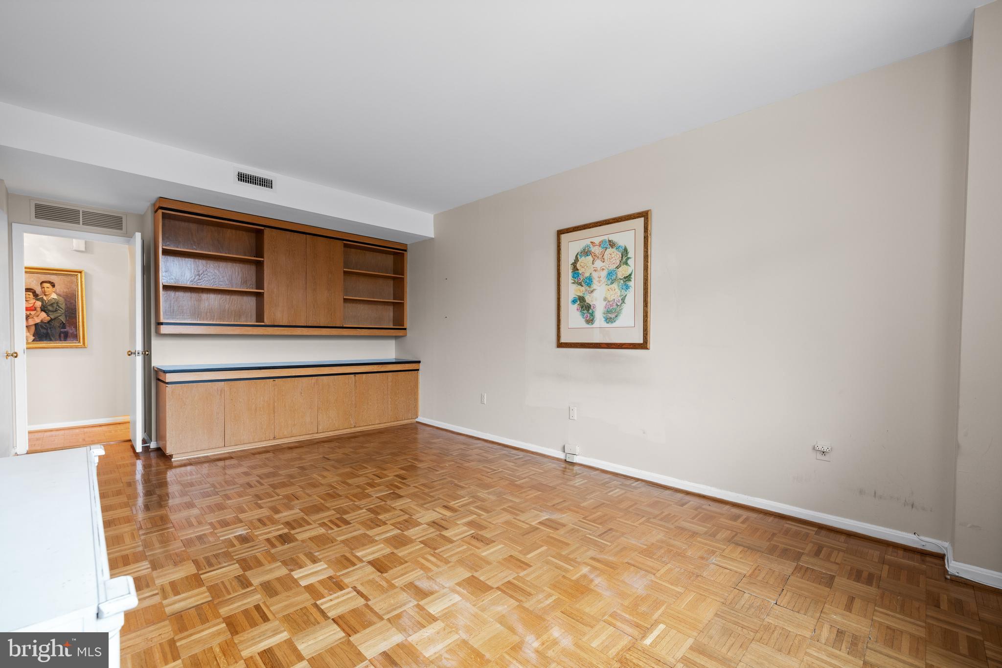 1 Slade Avenue, Unit 304 Baltimore, MD 21208 - Photo 30 of 44 a view of empty room with wooden floor