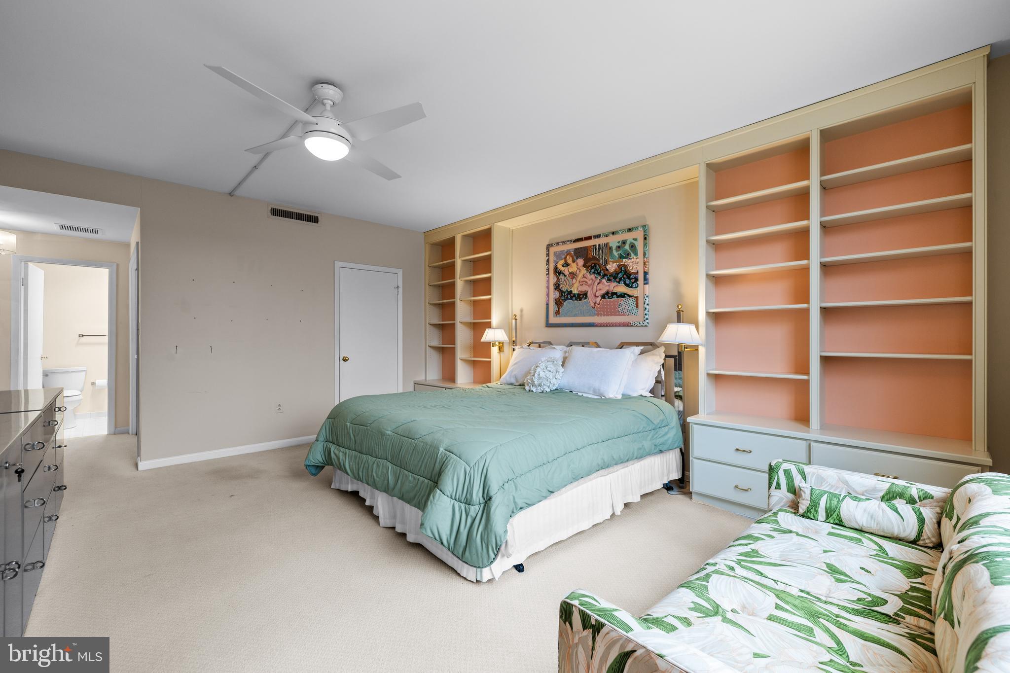 1 Slade Avenue, Unit 304 Baltimore, MD 21208 - Photo 35 of 44 a bedroom with a bed and a cabinets