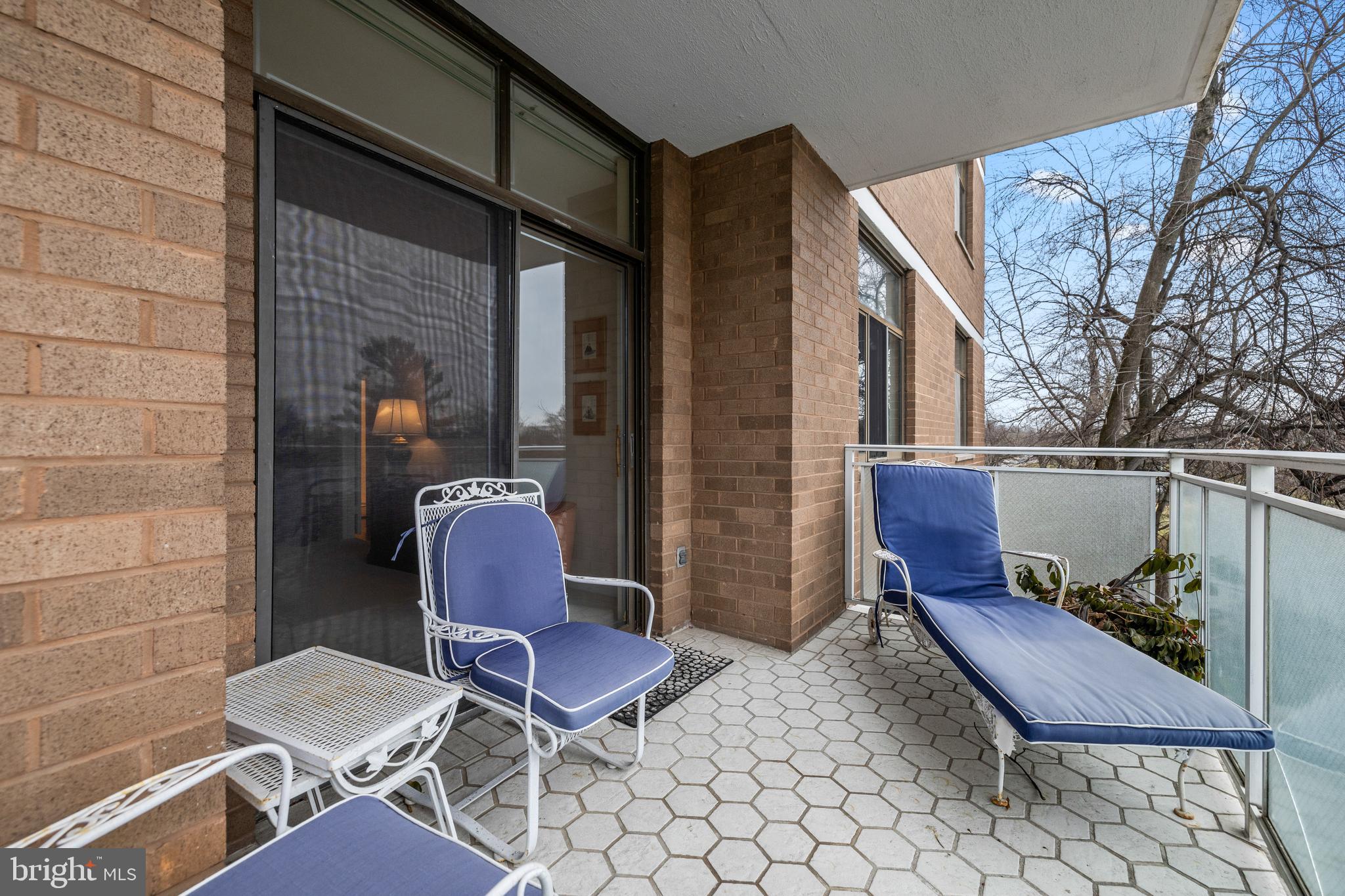 1 Slade Avenue, Unit 304 Baltimore, MD 21208 - Photo 39 of 44 a balcony with table and chairs