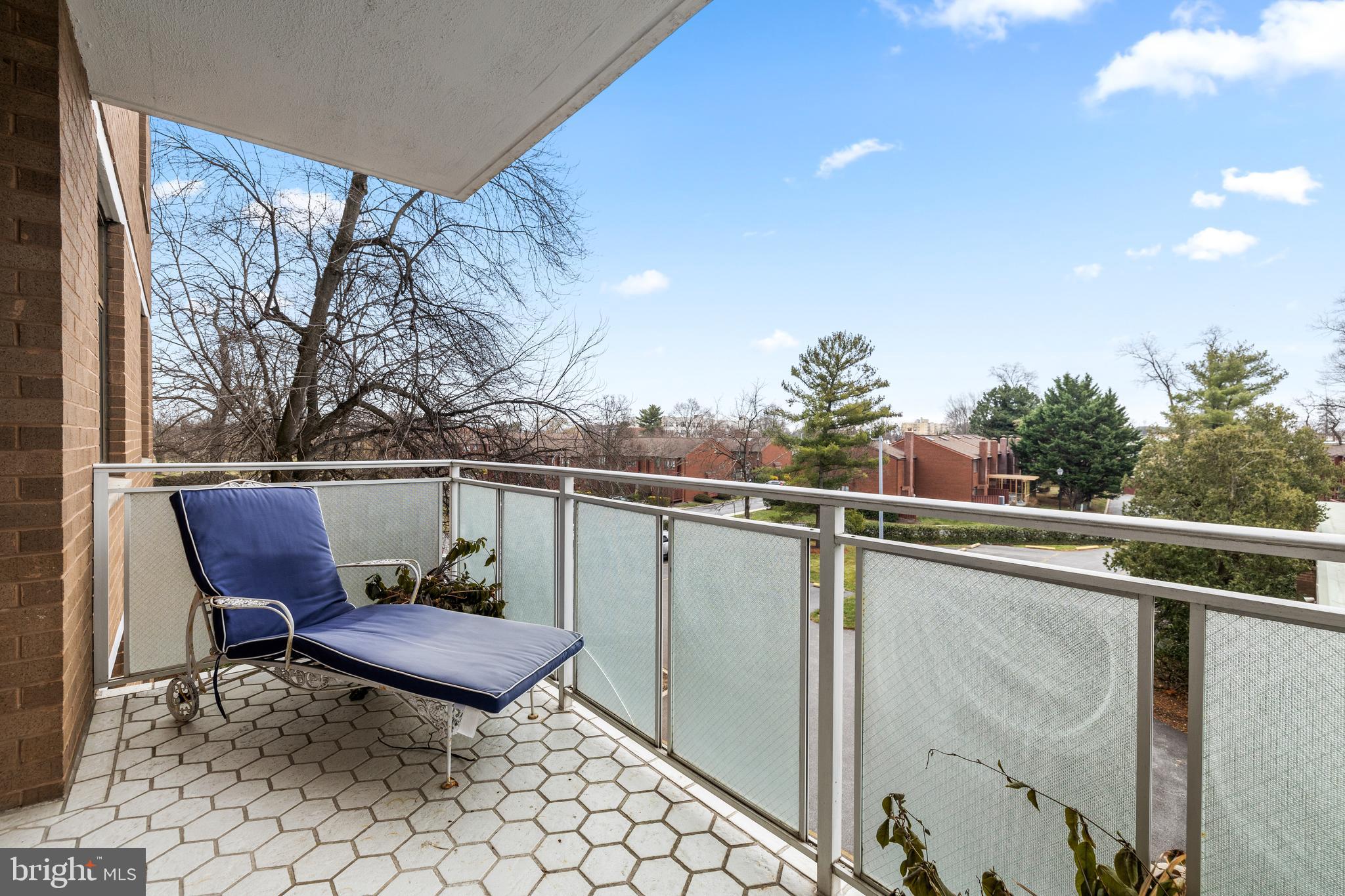 1 Slade Avenue, Unit 304 Baltimore, MD 21208 - Photo 40 of 44 a couple of chairs sitting in a roof deck with wooden fence