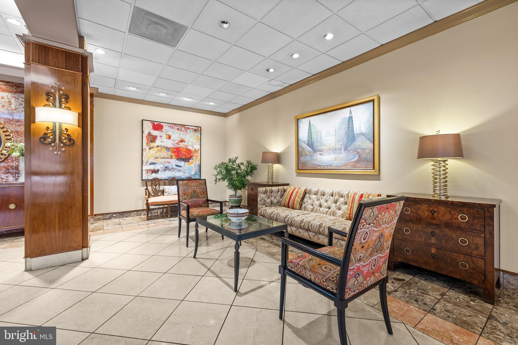 1 Slade Avenue, Unit 304 Baltimore, MD 21208 - Photo 4 of 44 a living room with furniture and a window
