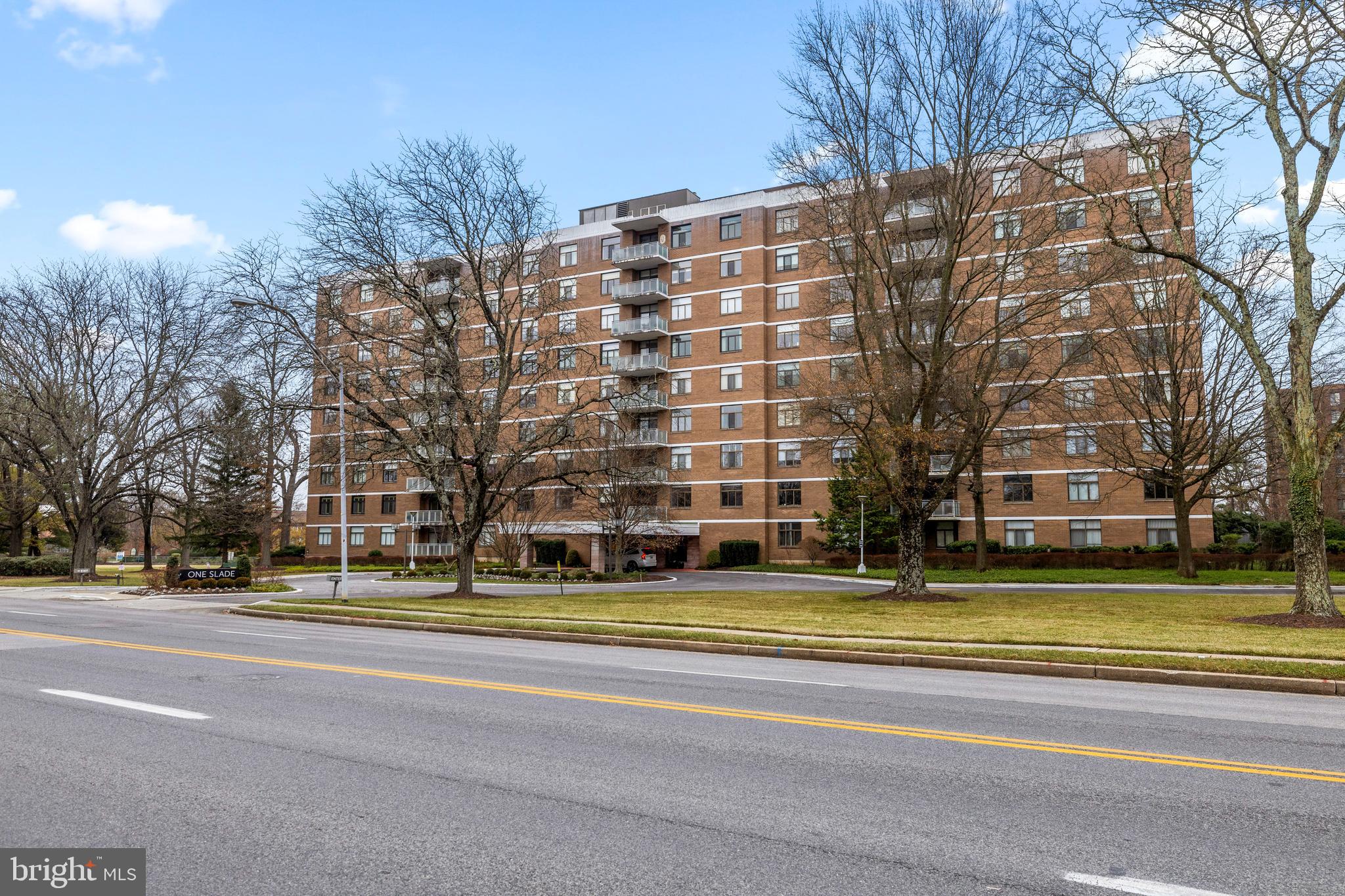 1 Slade Avenue, Unit 304 Baltimore, MD 21208 - Photo 44 of 44 a building with trees in front of it
