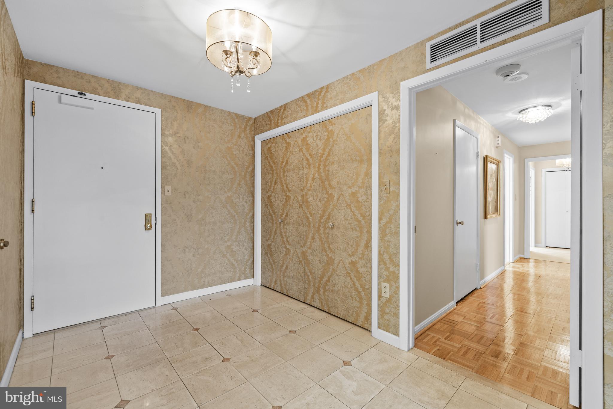 1 Slade Avenue, Unit 304 Baltimore, MD 21208 - Photo 9 of 44 a view of a hallway with front door