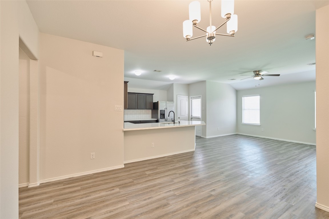 24439 Raindrop Poppy Drive Spring, TX 77373 - Photo 12 of 27 a view of kitchen with granite countertop cabinets and refrigerator