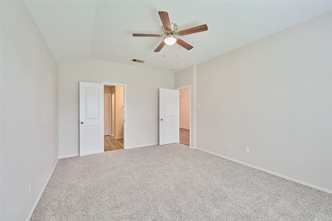 24439 Raindrop Poppy Drive Spring, TX 77373 - Photo 19 of 27 a view of a livingroom with a ceiling fan