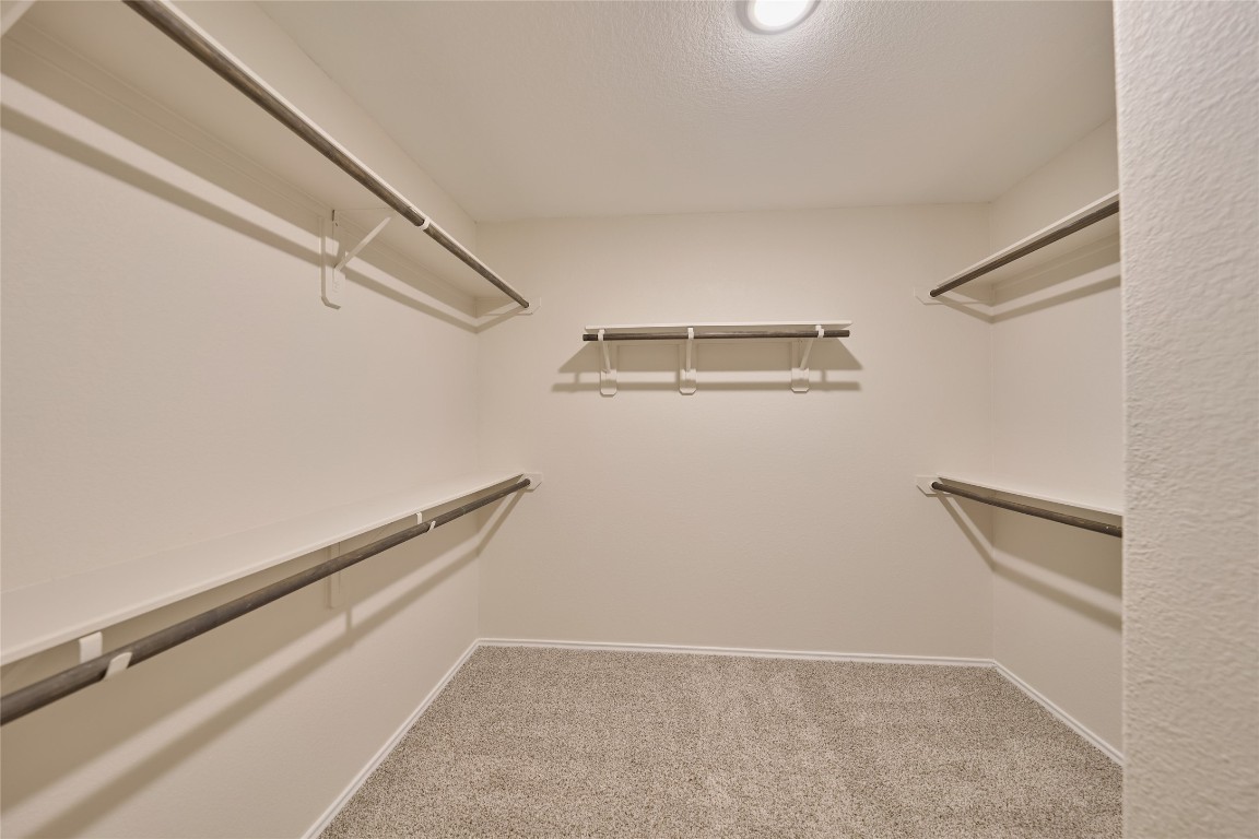 24439 Raindrop Poppy Drive Spring, TX 77373 - Photo 22 of 27 a view of an empty walk in closet