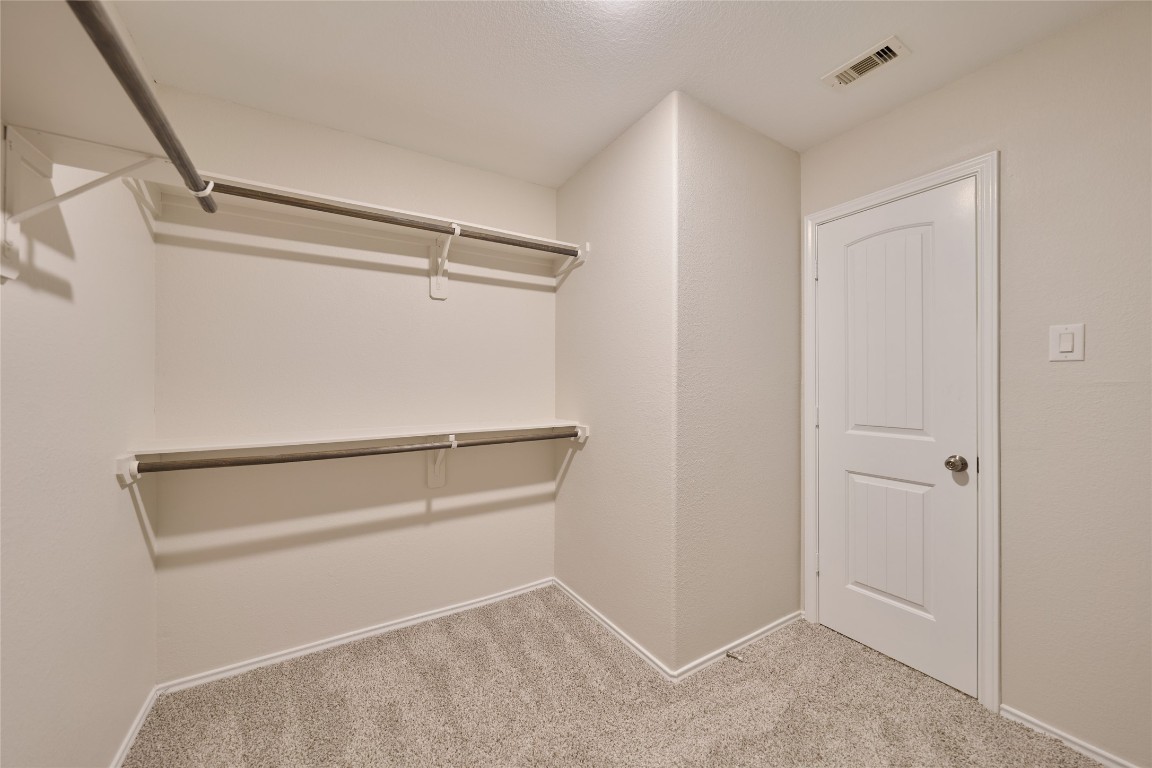 24439 Raindrop Poppy Drive Spring, TX 77373 - Photo 23 of 27 a view of an empty walk in closet