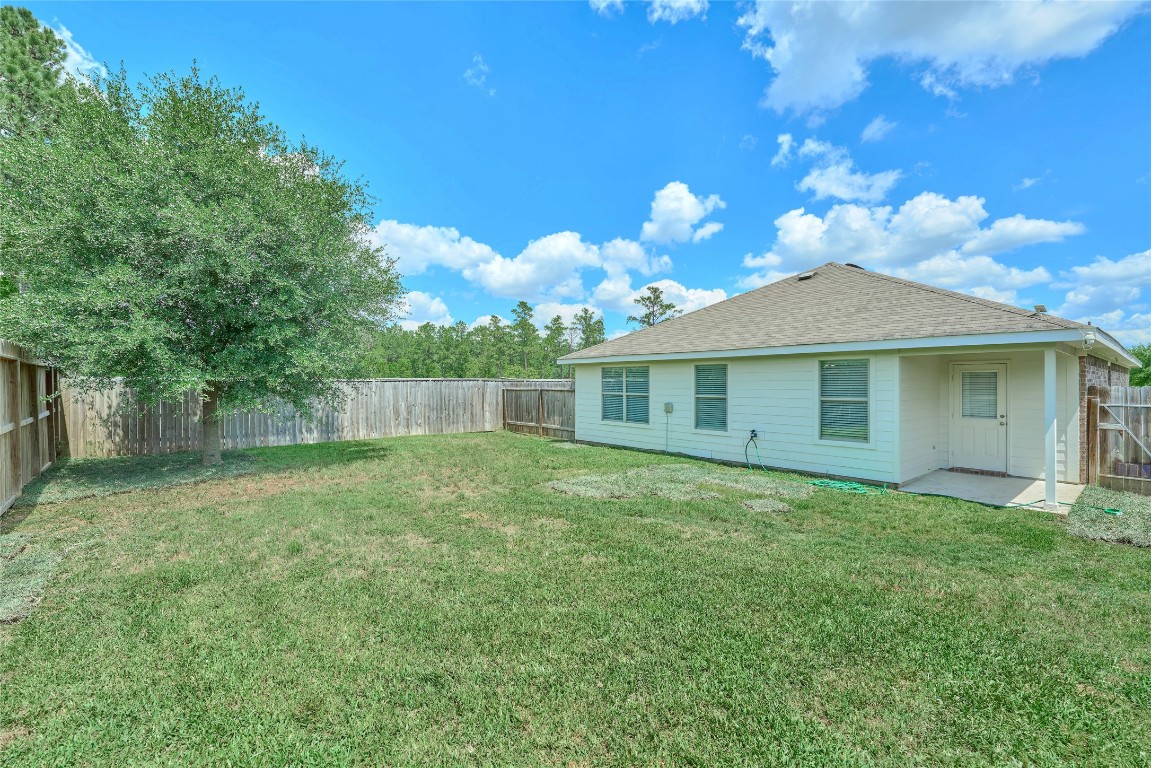 24439 Raindrop Poppy Drive Spring, TX 77373 - Photo 26 of 27 a front view of a house with garden