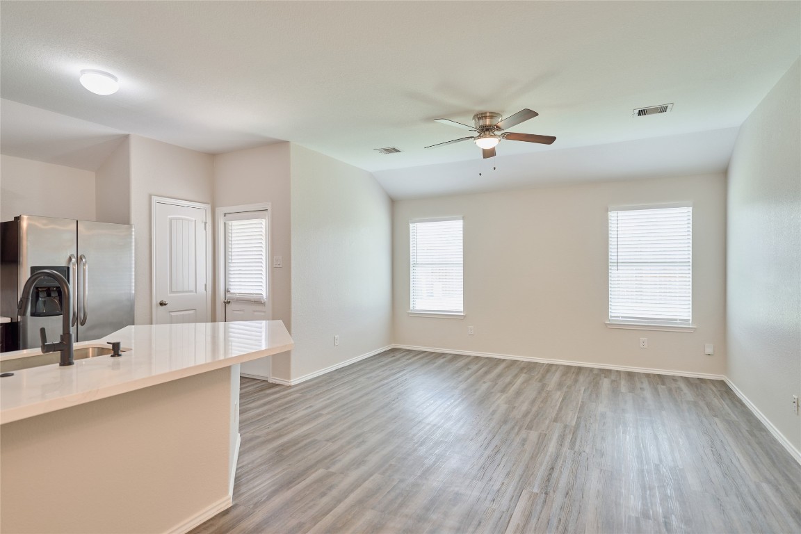 24439 Raindrop Poppy Drive Spring, TX 77373 - Photo 9 of 27 a view of a kitchen with marble kitchen and sink