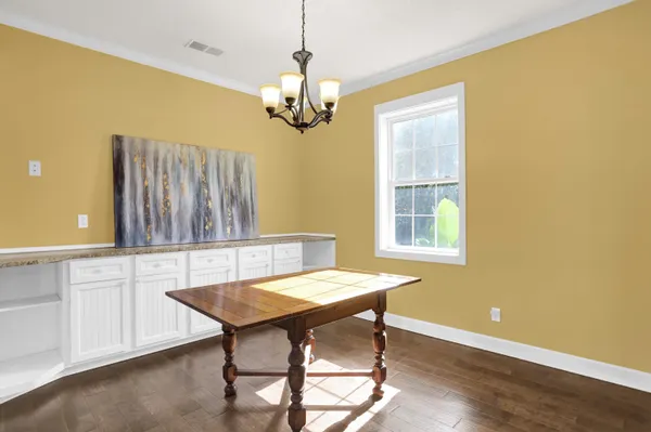 a kitchen with stainless steel appliances granite countertop a refrigerator a stove a sink and a microwave