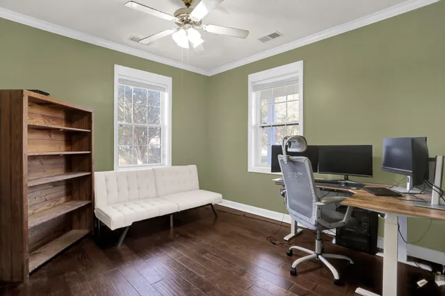 a kitchen with kitchen island a stove a chandelier and a refrigerator