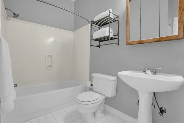 a workspace with wooden floor and a window