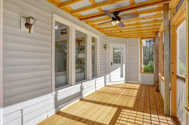 a view of a balcony with wooden floor