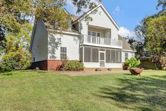 a spacious bathroom with a tub and shower