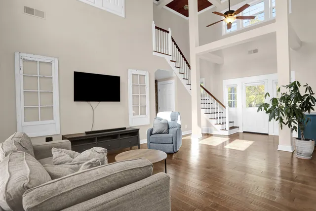 a living room with furniture and a flat screen tv