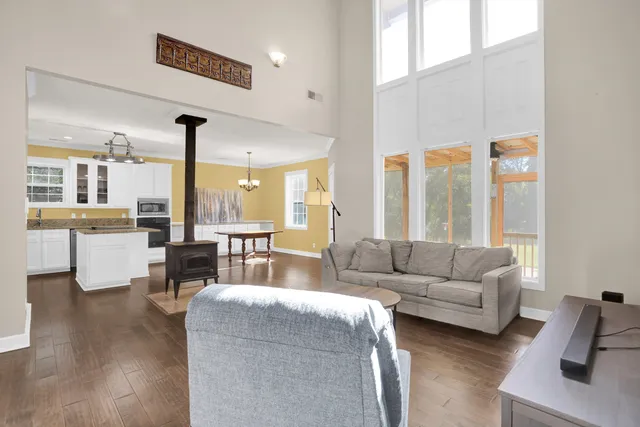 a view of a house with backyard and sitting area