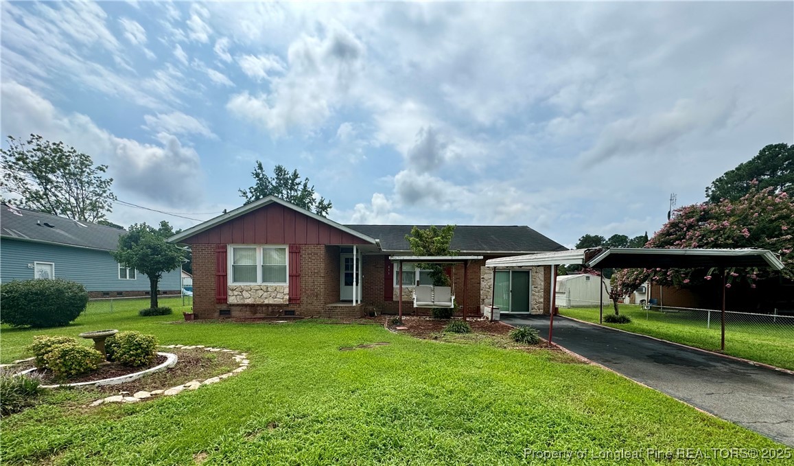 611 Reggie Court Spring Lake, NC 28390 - Photo 1 of 20 a front view of a house with a yard