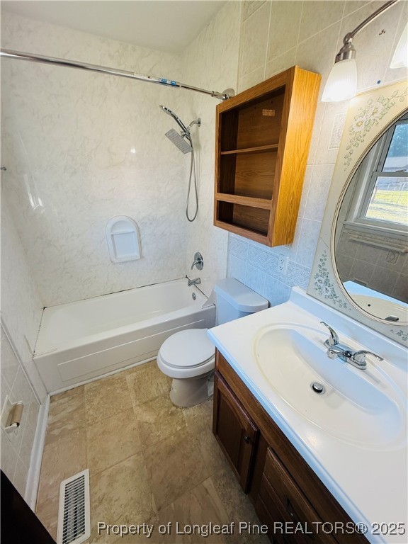 611 Reggie Court Spring Lake, NC 28390 - Photo 14 of 20 a bathroom with a sink a toilet and shower