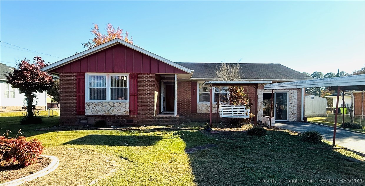 611 Reggie Court Spring Lake, NC 28390 - Photo 2 of 20 a front view of a house with a yard