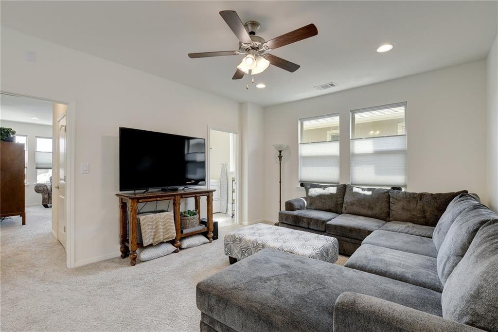 228 Simon Kyle, TX 78640 - Photo 14 of 35 Living room featuring carpet flooring, a ceiling fan, and recessed lighting