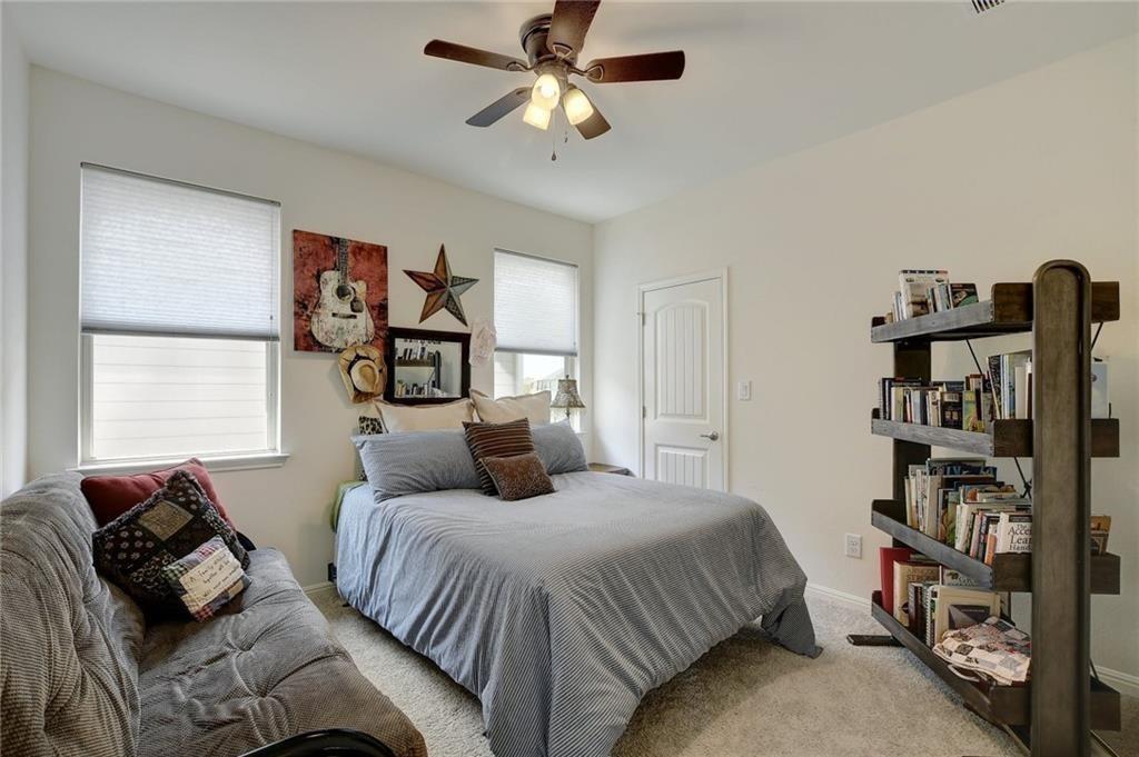 228 Simon Kyle, TX 78640 - Photo 20 of 35 Bedroom with carpet flooring and a ceiling fan
