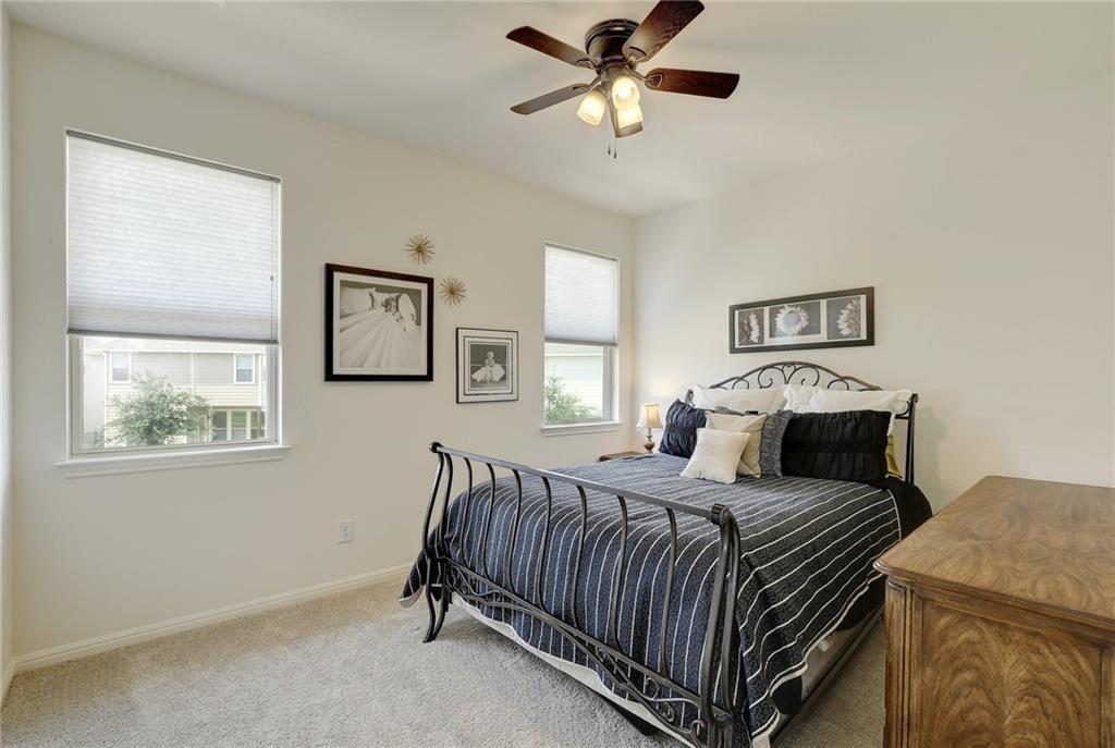 228 Simon Kyle, TX 78640 - Photo 22 of 35 Carpeted bedroom featuring ceiling fan and baseboards