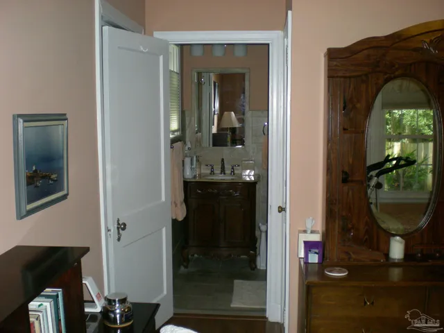 a view of living room and wooden floor