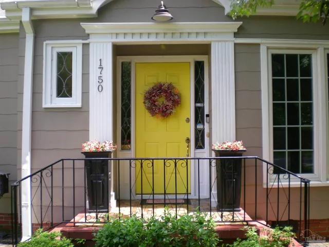 a view of a door with a small garden