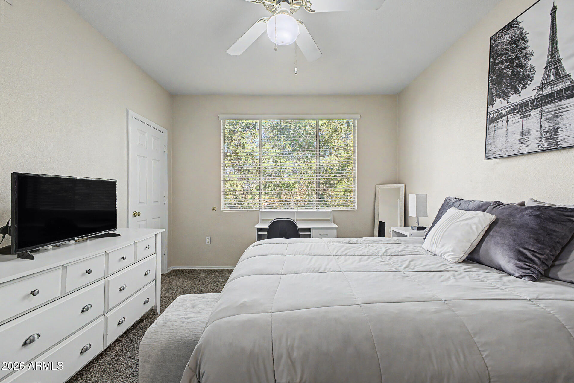5401 East Van Buren Street, Unit 3017 Phoenix, AZ 85008 - Photo 11 of 37 a bedroom with a bed and a flat screen tv