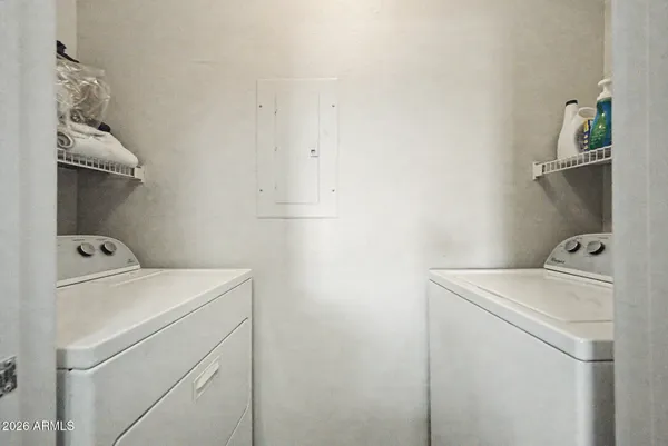 a utility room with dryer and washer