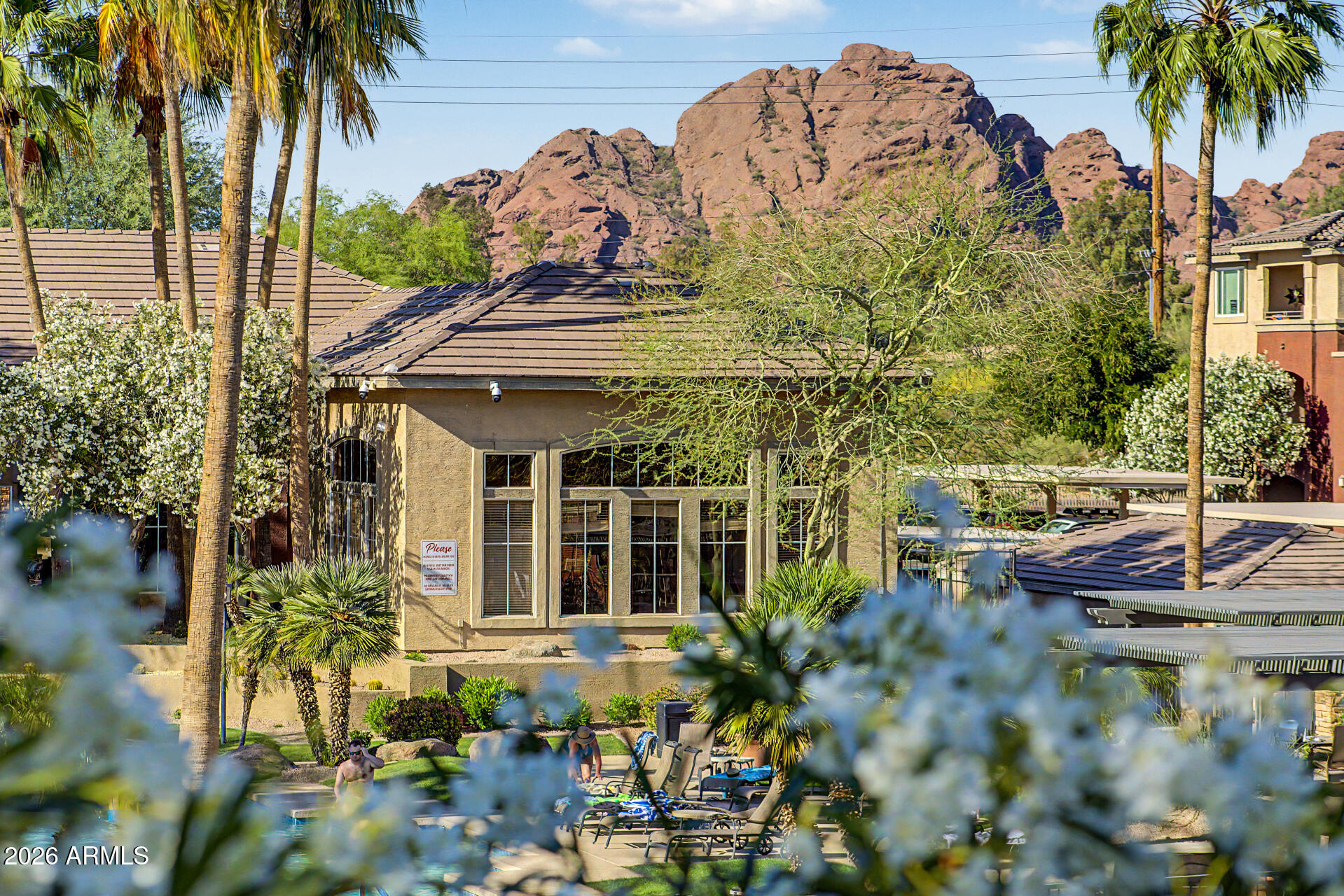5401 East Van Buren Street, Unit 3017 Phoenix, AZ 85008 - Photo 23 of 37 front view of a house with a garden