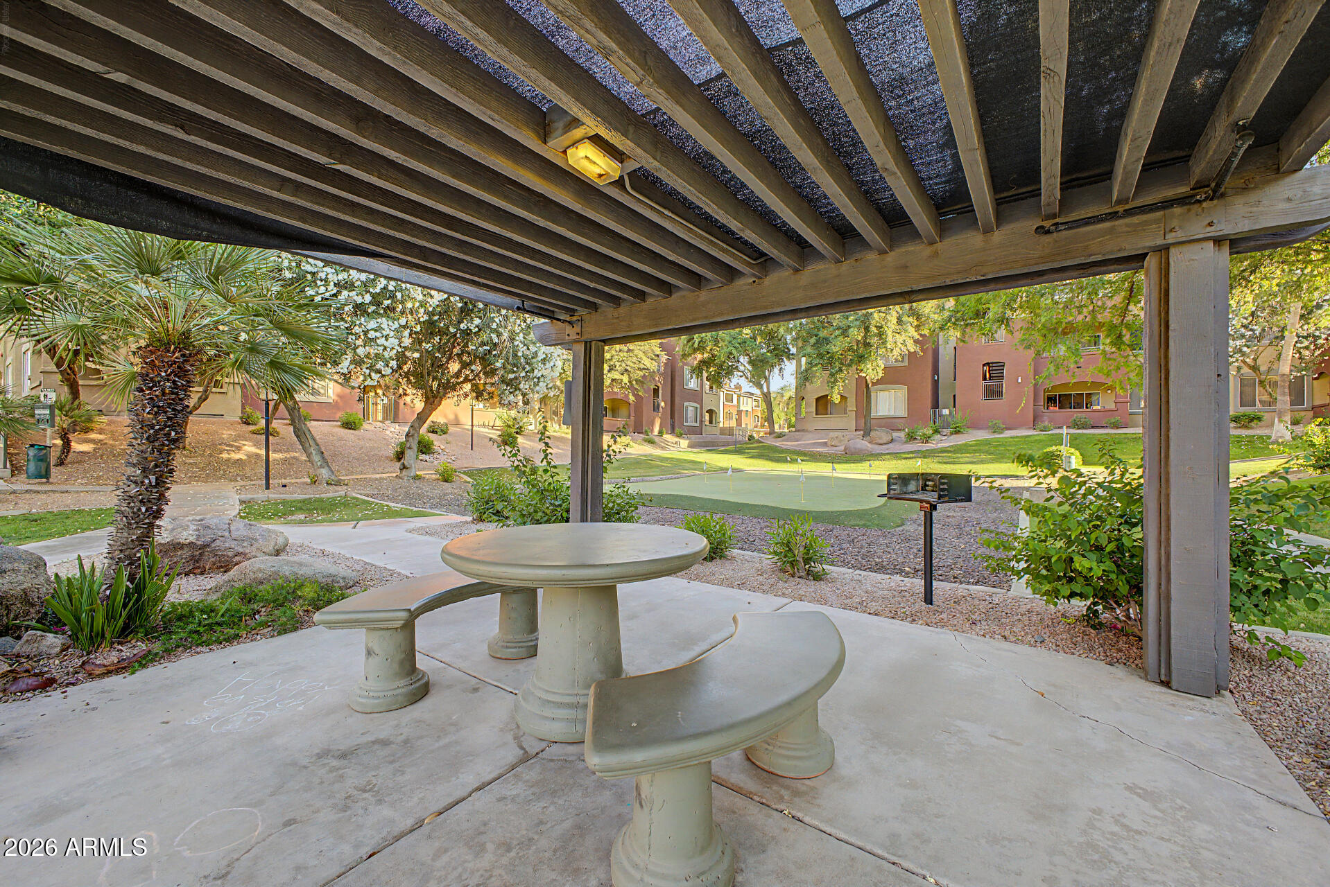 5401 East Van Buren Street, Unit 3017 Phoenix, AZ 85008 - Photo 25 of 37 a view of a porch with furniture and yard