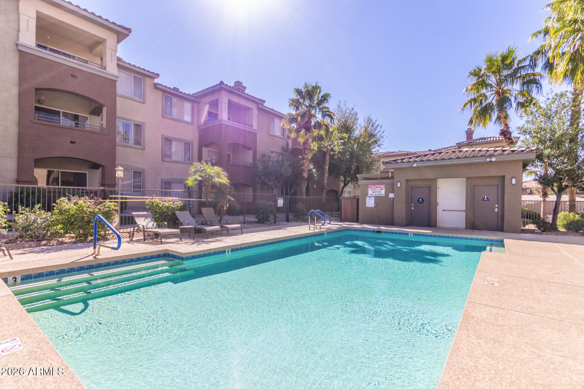 5401 East Van Buren Street, Unit 3017 Phoenix, AZ 85008 - Photo 27 of 37 a front view of house with yard and green space