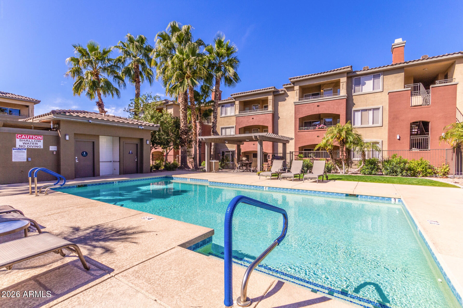 5401 East Van Buren Street, Unit 3017 Phoenix, AZ 85008 - Photo 28 of 37 a swimming pool with outdoor seating and yard