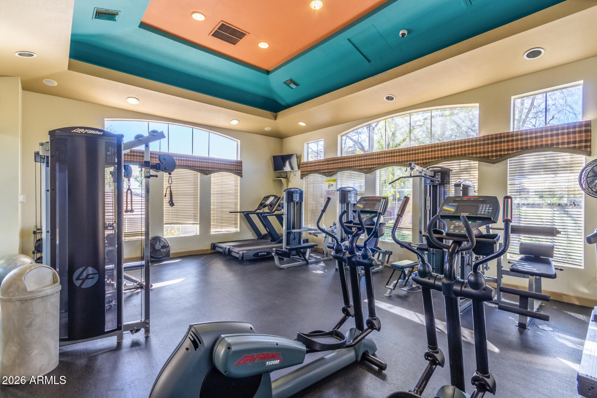 5401 East Van Buren Street, Unit 3017 Phoenix, AZ 85008 - Photo 30 of 37 a gym room with gym equipment